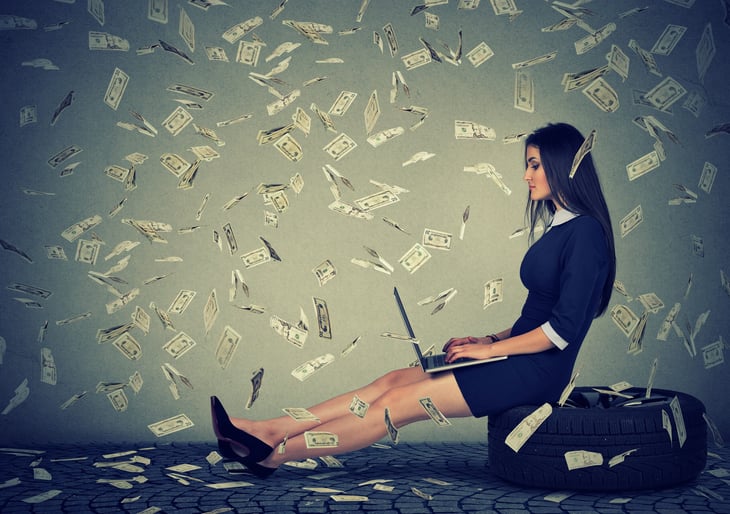 Money raining on woman