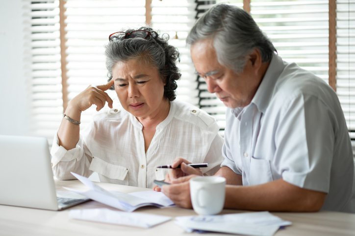 A senior couple reviewing benefit changes under the One Big Beautiful Act.