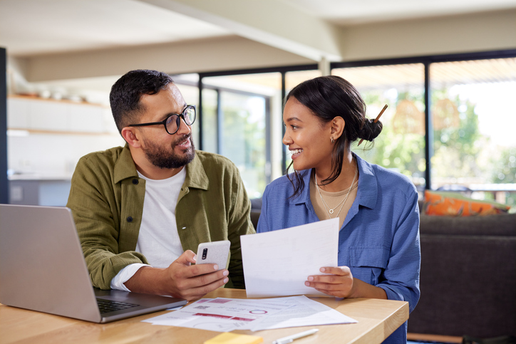 A couple reviews a tax strategy to minimize their liability.